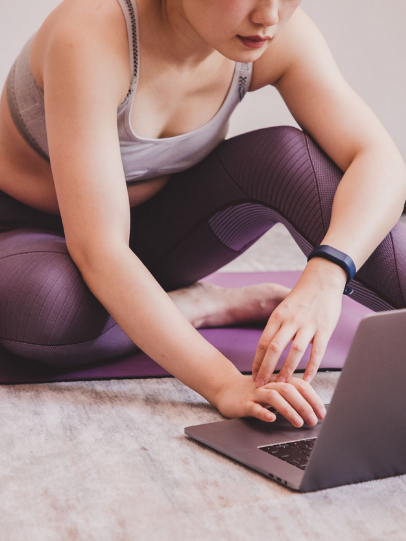 A woman working on the computer.