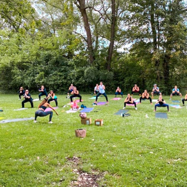 Nicole Nahed training a group of women at the park.